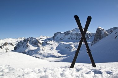 Pair of cross skis in snow clipart
