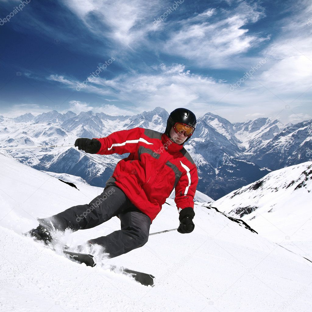 Young skier in high mountains