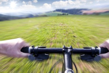 Mountain biking down the trail, motion blur clipart