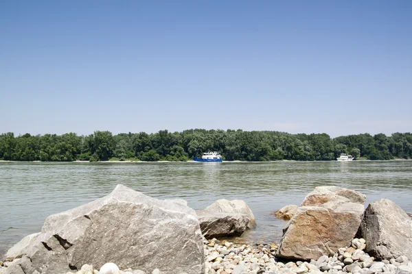 Donau river with boat and rocks — Stock Photo, Image