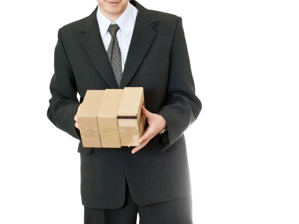 Uomo d'affari che tiene la scatola su sfondo bianco — Foto Stock