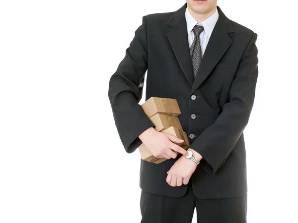 Podnikatel drží box na bílém pozadí — Stock fotografie