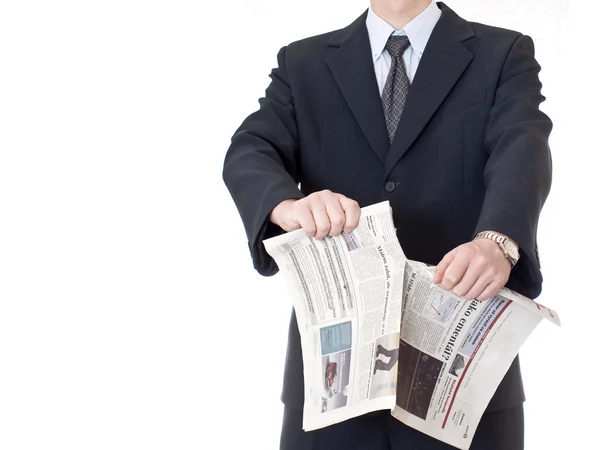 Business tearing the stock pages of a newspaper — Stock Photo, Image