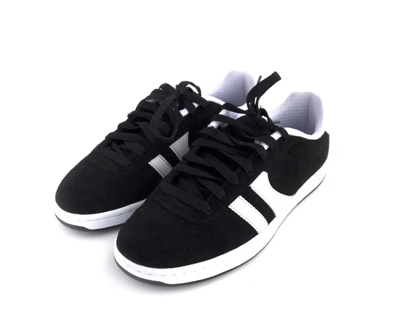 Schwarze und weiße Schuhe — Stockfoto