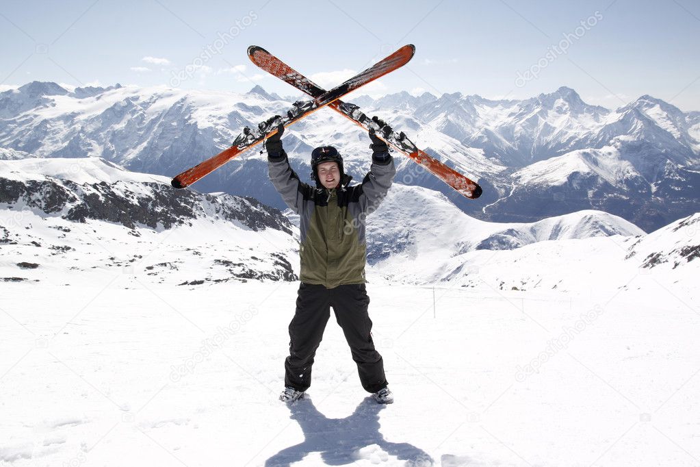 Man holding skis up