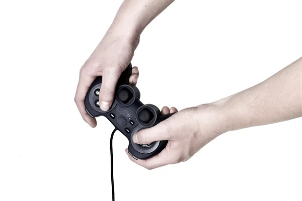 男性の手は、ビデオゲームのコント ローラーを保持します。 — ストック写真