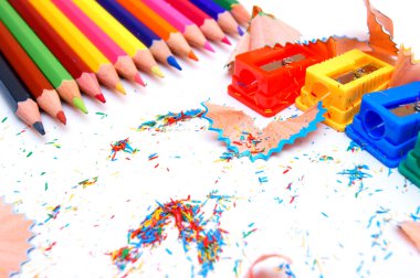 Sharpeners and pencils on a white background. clipart