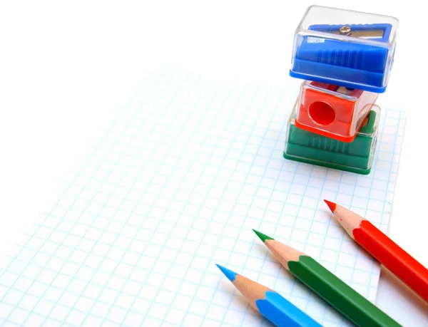 Sharpeners and pencils on a white background. — Stock Photo, Image