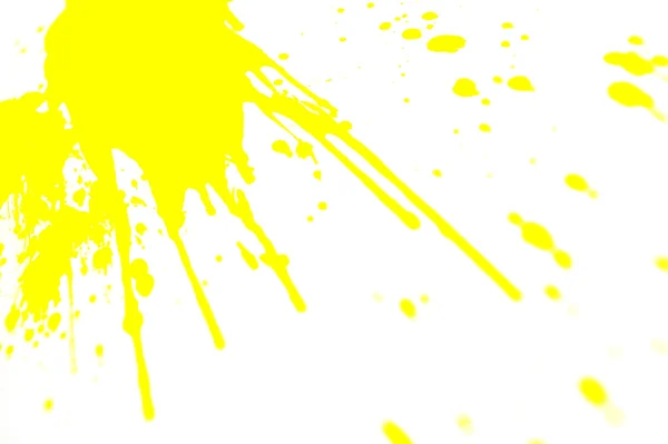 Salpicos amarelos no fundo branco . — Fotografia de Stock
