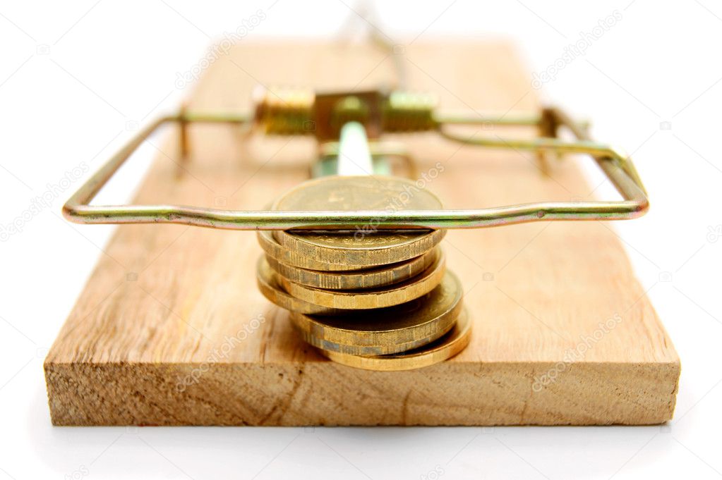 Coins in mousetrap. On a white background.