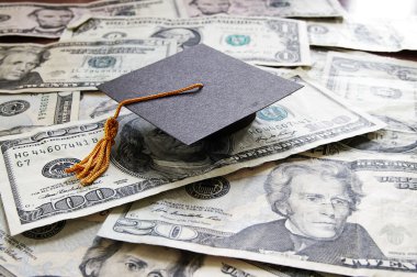 Graduation cap on cash