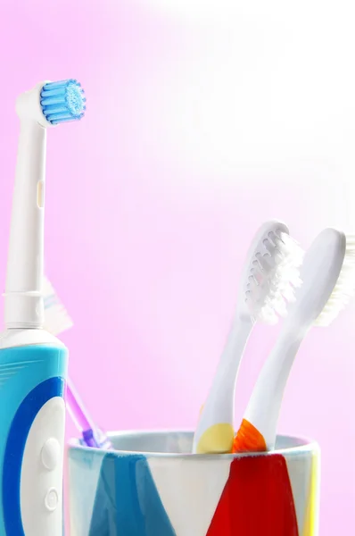 Assorted tooth brushes, an electric and regular — Stock Photo, Image