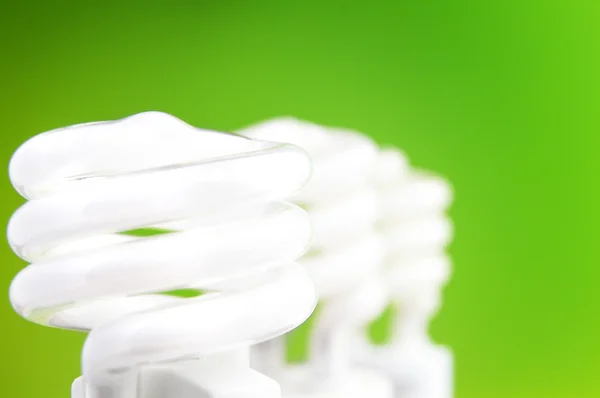 Light bulbs on green — Stock Photo, Image