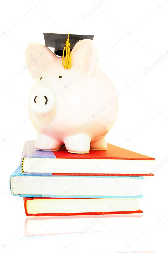 Piggy bank on book pile