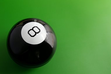 Closeup of a billiard 8 ball on a pool table clipart