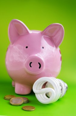 Piggy bank with eficient light bulb and Euro coins clipart