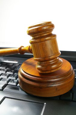 Gavel on a laptop clipart