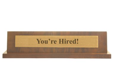 Isolated nameplate with You're Hired text on it clipart