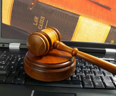 Gavel on a laptop computer clipart