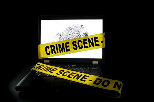 stock image Computer with crime scene tape