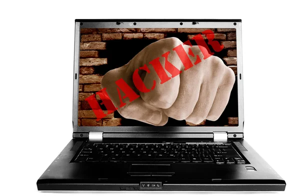 Laptop with fist punching thru a brick wall — Stock Photo, Image