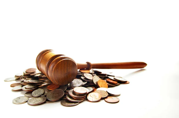Gavel on a pile of coins — Stock fotografie