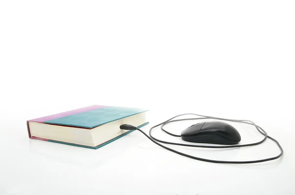 Mouse plugged into a book — Stock Photo, Image