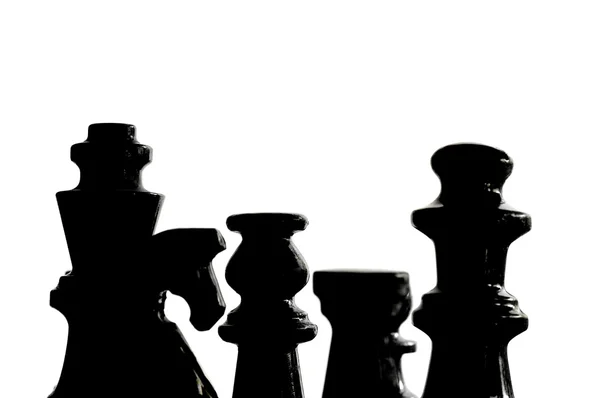Chess pieces in silhouette, isolated on white — Stock Photo, Image