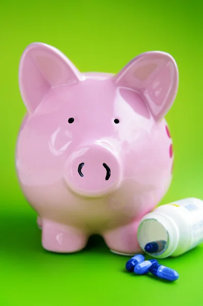 Piggy bank with pills — Stock Photo, Image