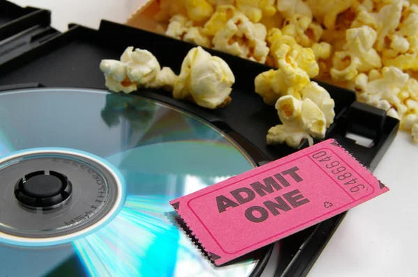 Ticket stub and popcorn with DVD closeup — Stock Photo, Image
