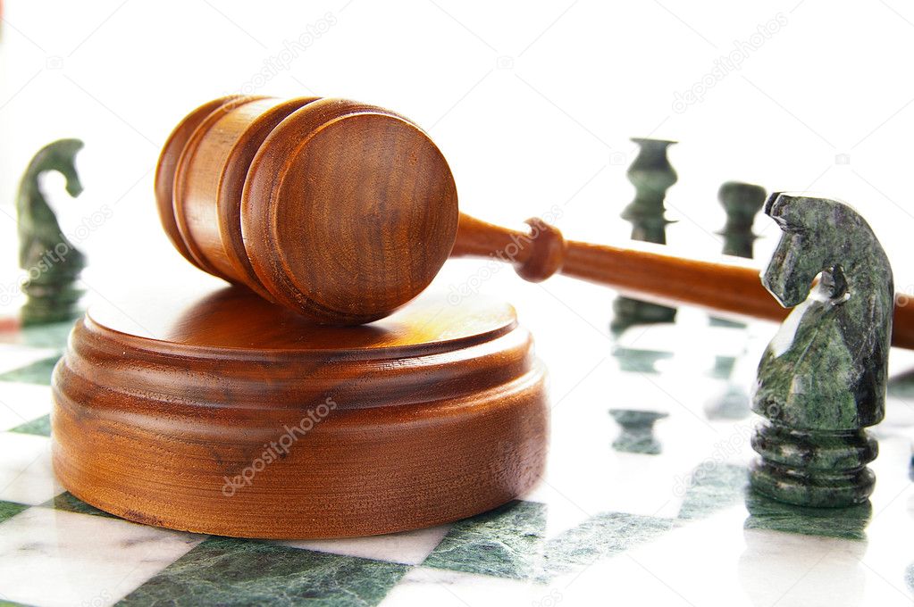 Chess pieces and law gavel