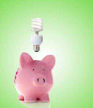 Piggy bank with bulb clipart