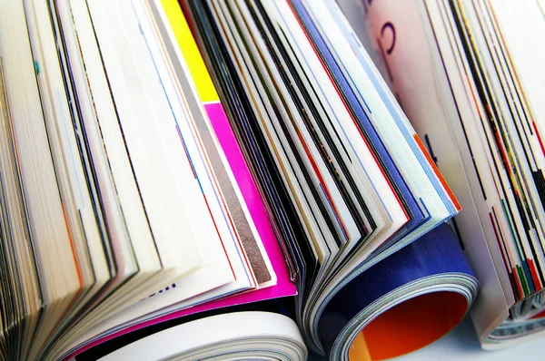 Closeup of rolled up magazines, from above — Stock Photo, Image