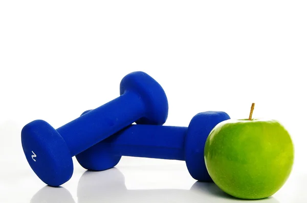 Gewichte und Apfel — Stockfoto