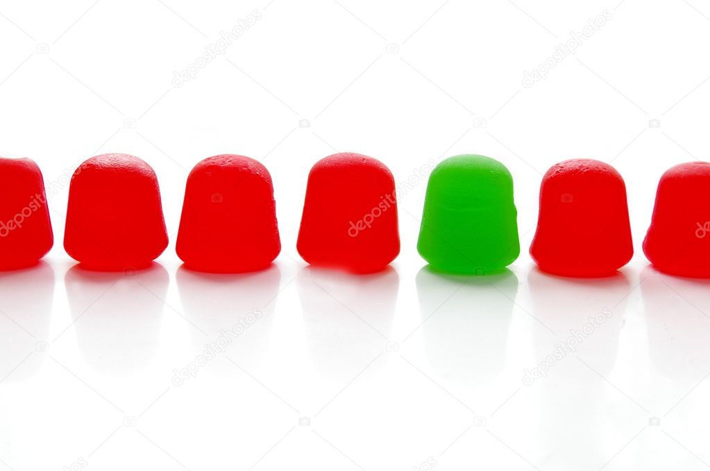 Assorted brightly colored candy gum drops on white.