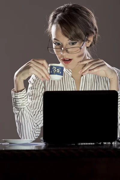 stock image Young excited lady in front of her laptop