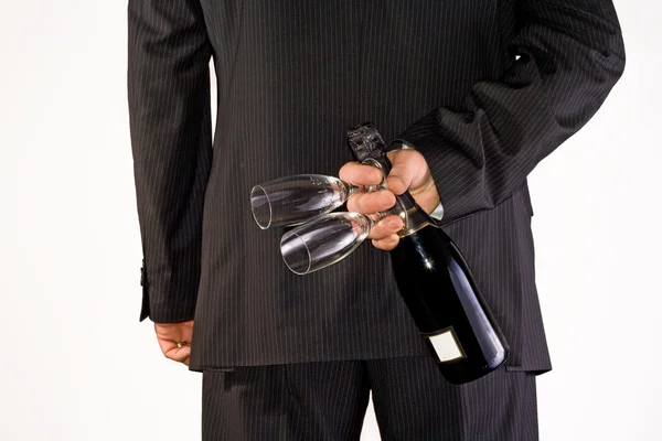 stock image Man hiding back bottle and glasses