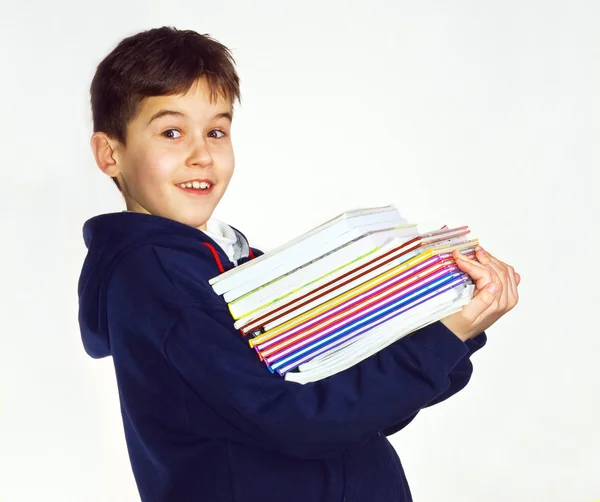 Мальчик с книгами в руках — стоковое фото