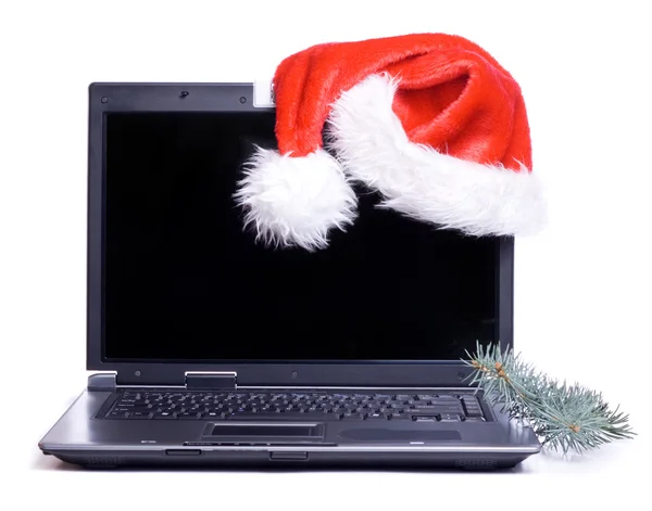 stock image Santa's hat on a lap top