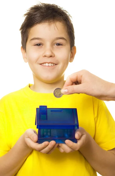 Boy with coin bank — Stock Photo, Image