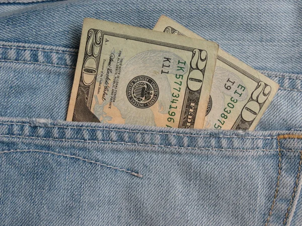 USD notes in blue jeans pocket — Stock Photo, Image