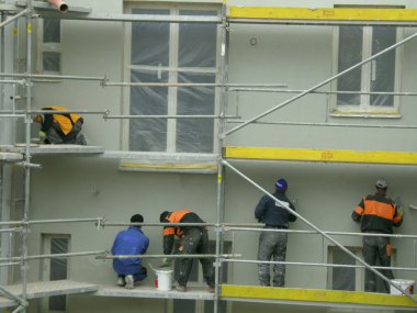 Masons on a scaffolding clipart