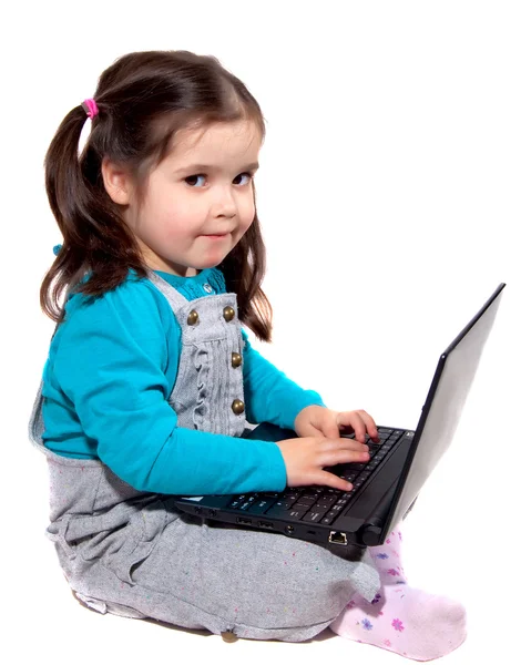 Kind mit Laptop Stockfoto