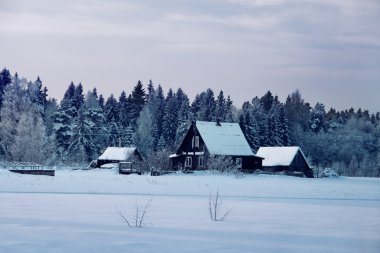 Russian bath at end of field with cottage clipart