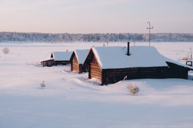 Village house on outskirts of snow clipart