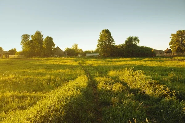 stock image Sunshine on picturesque entrance to village