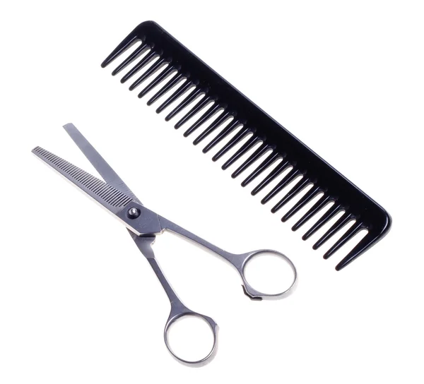Hairdressing scissors and comb isolated on a white background. — Stock Photo, Image