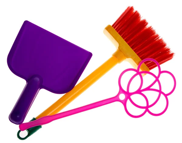 Toy plastic dustpan, carpet beater and broom isolated on a white — Stock Photo, Image