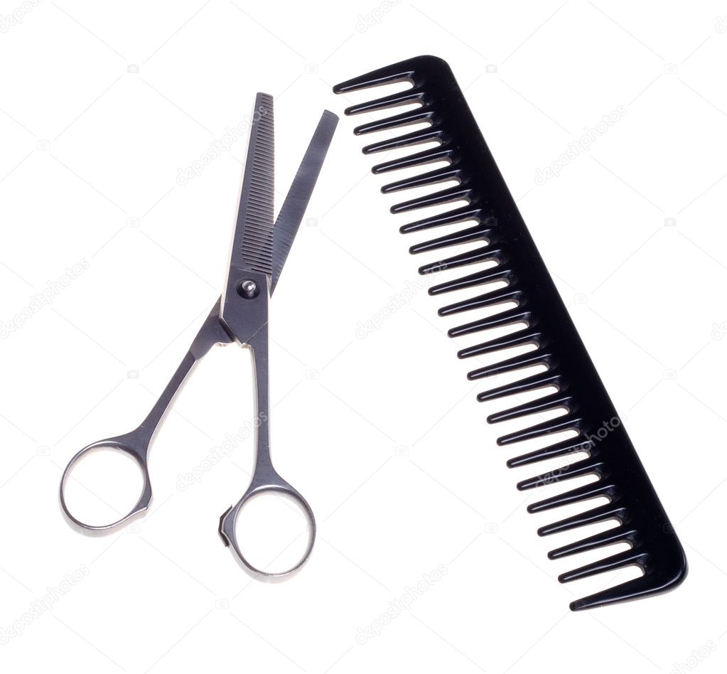 Hairdressing scissors and comb isolated on a white background.