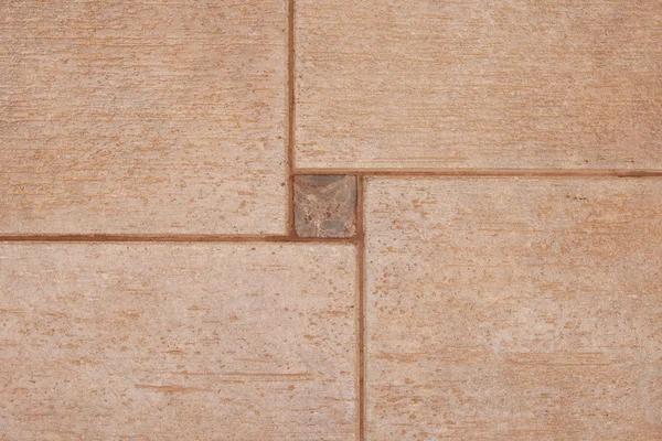 De textuur van bruin keramische tegels kan worden gebruikt als achtergrond. Stockfoto